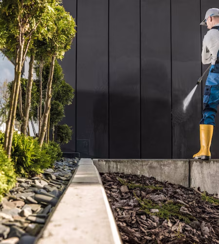 professional-worker-pressure-washing-house-walls_1426-17328